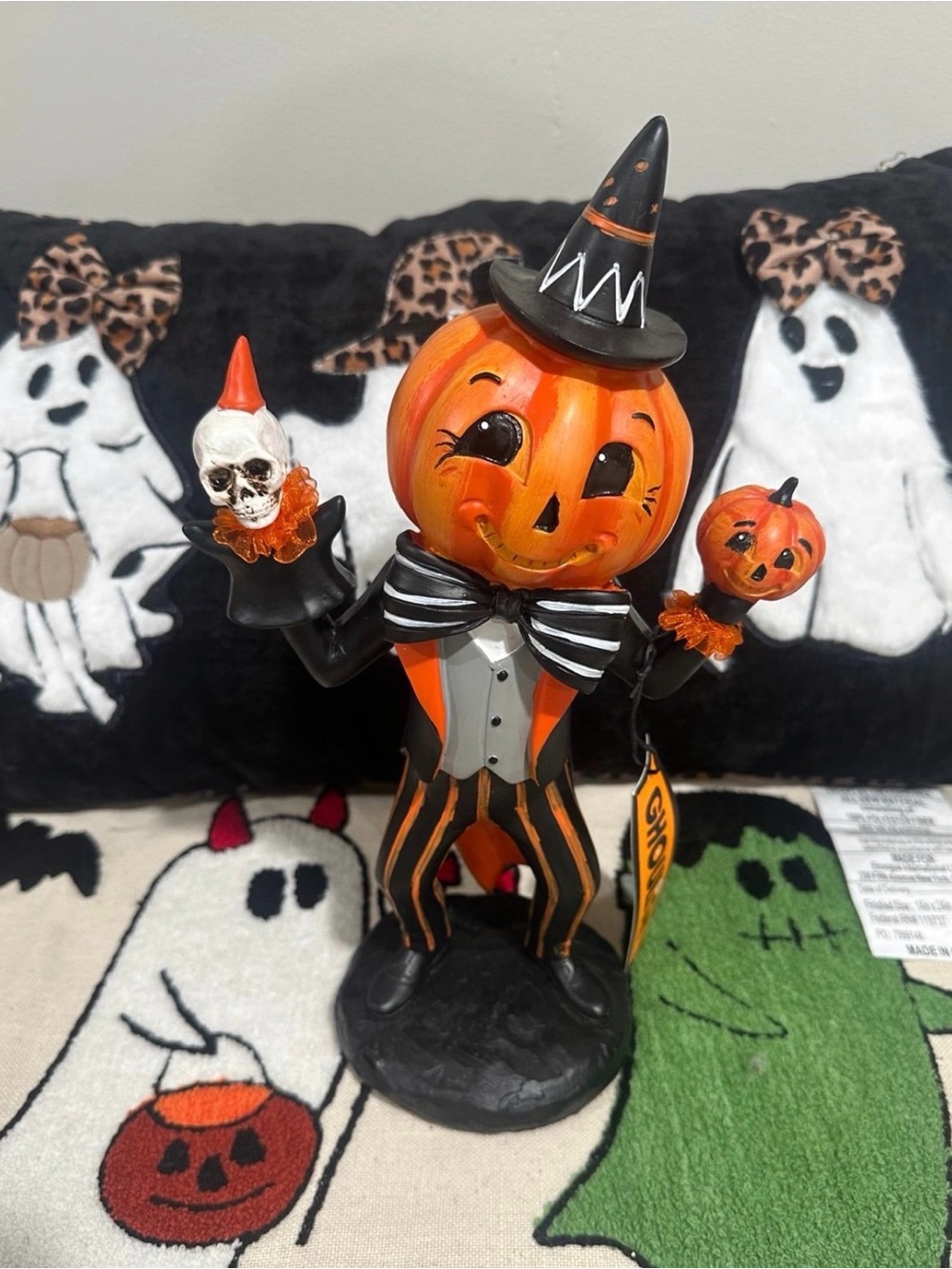 Halloween Ghoulish Vintage-looking Dapper Pumpkin Man Jester holding skull